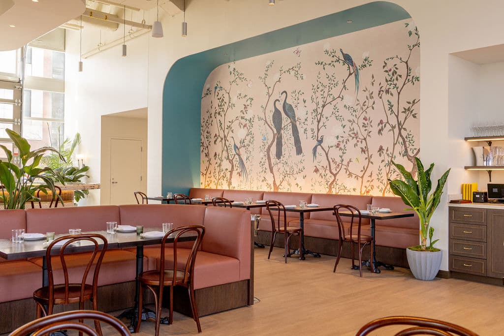Dining room with hand-painted chinoiserie mural at Petite Edith — French bistro in Chicago's River North